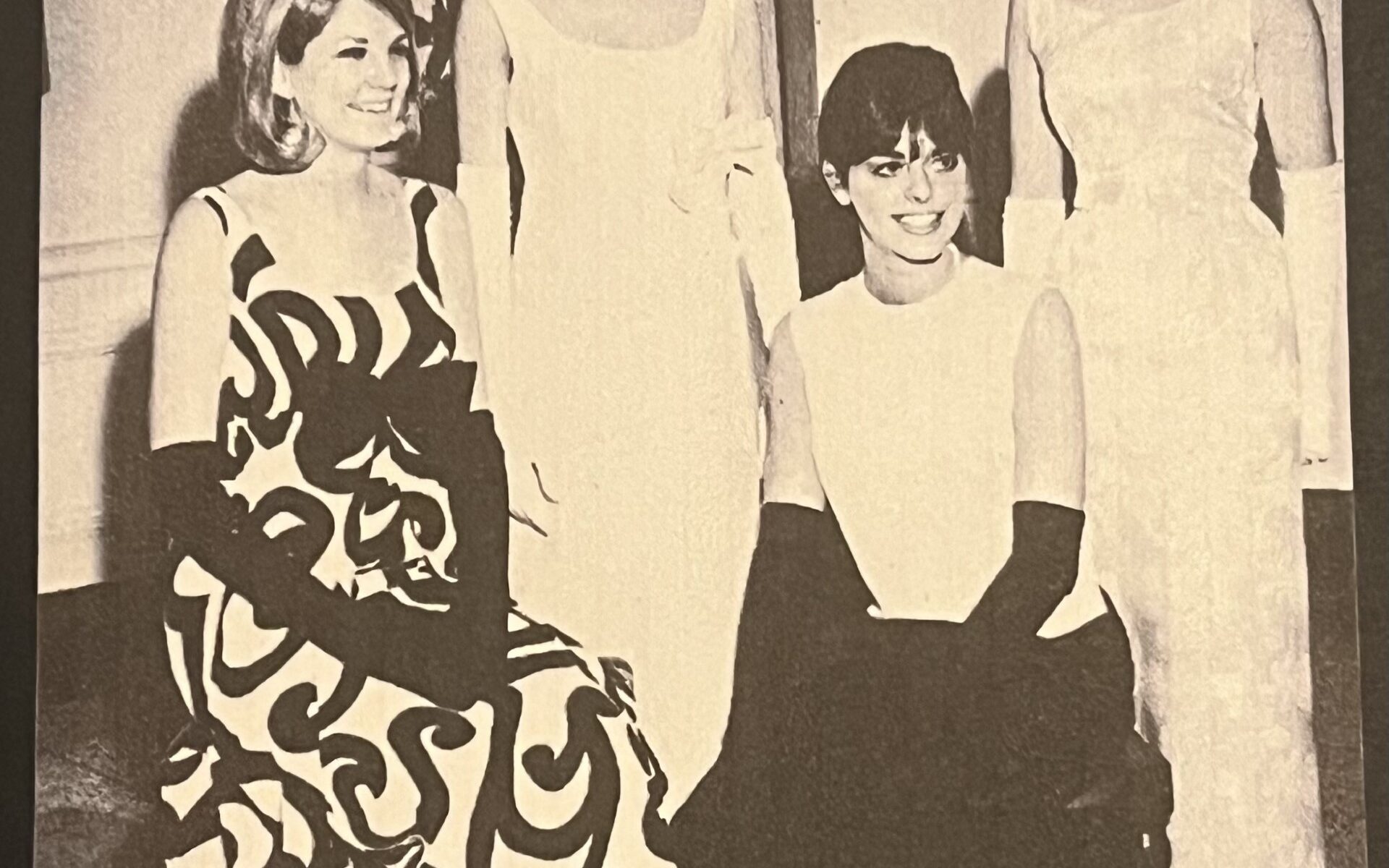 The Queens court. 4 girls siting and standing in a row. Black and white image.
